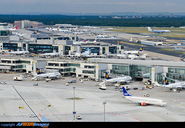 Overview of Terminal 1 Concourses A, B and C and the ramp in front of Terminal 2 with a countless number of aircraft in the picture! Taken from the air traffic control tower. Frankfurt Main Airport
