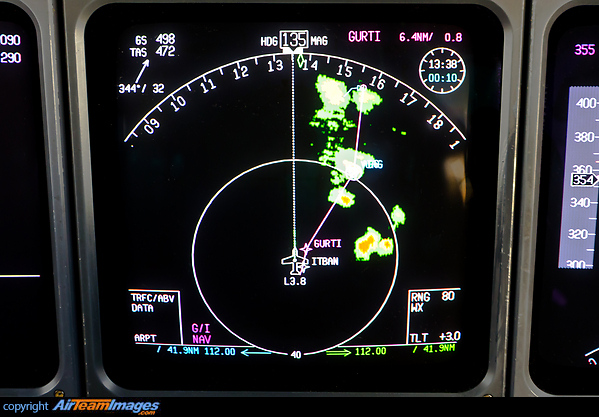 Weather deviation - flying straight ahead instead of turning onto the standard route where some heavy rain showers and thunderstorms are located. McDonnell Douglas MD-11F