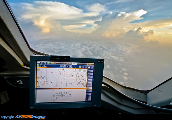 Towering cumulonimbus clouds near Delhi, with the standard departure route depicted on the Electronic Flight Bag (EFB Electronic Flight Bag (EFB)