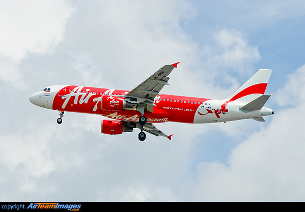 The Cumulonimbus clouds in the back were massive and brought heavy rain! The aircraft is one of 22 A320s in the Indonesian fleet. Airbus A320-216