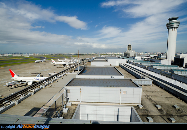 Airport overview of Terminal 1 ramp and control tower. Tokyo Haneda Airport