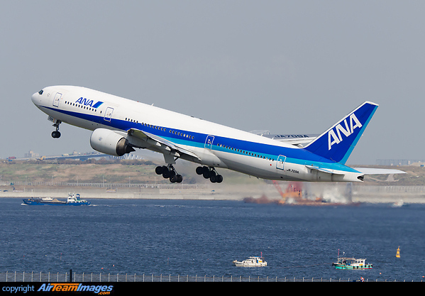 Departing from runway 34R on a clear autumn day. Boeing 777-281/ER