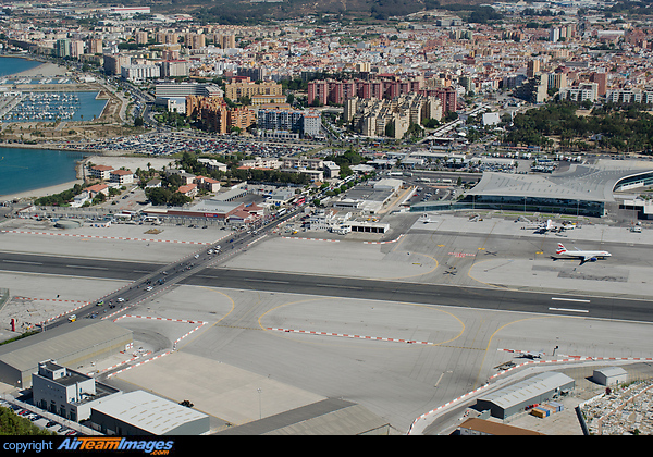 overlooking the Airport of Gibraltar with the street that crosses the Runway visible as well as the new Terminal Gibraltar Airport
