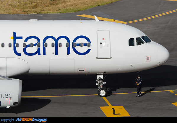 The ramp agent is on the head-set for some last minute communication with the crew, before they taxi out for departure. Airbus A320-233