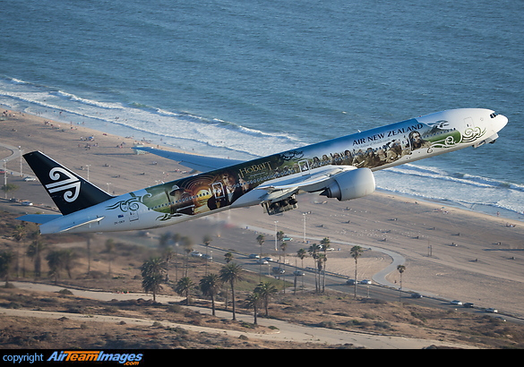 Heading for London the Hobbit blasts over an LA beach with the gear cycling up. Boeing 777-319/ER