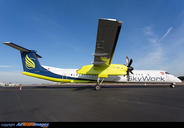 Carrier for the football team of FC THUN with additional sticker in front of the a/c. Bombardier Dash 8-402Q