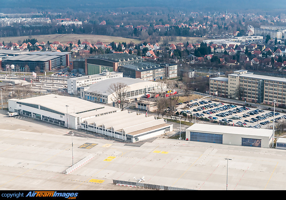 Dresden Airport old terminal building now used for catering, long-term parking and various other buildings belonging to the airport in front of a local housing area. Dresden Airport