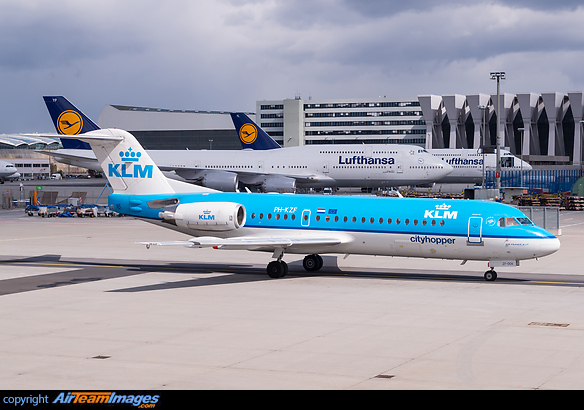 Taxi-in after landing. In the background are two Lufthansa Boeing 747-8 (reg. D-ABYP and D-ABYL) in the maintenance area. Fokker 70