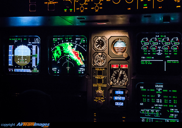 Approach to Almaty with the navigation display showing terrain information from the EGPWS. The primary flight display and standby instruments are visible, as well as the ECAM (Electronic Centralized Aircraft Monitoring). Airbus A340-313X