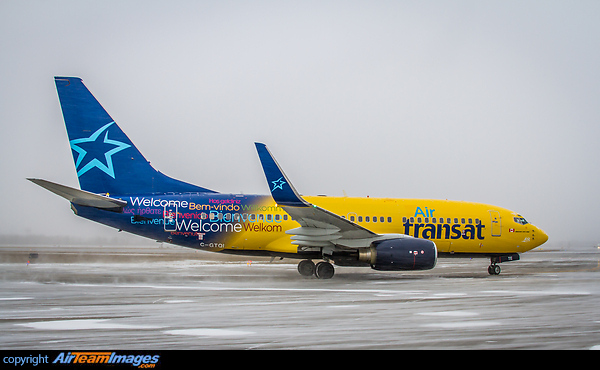 Hybrid livery for this B737 as it leaves snowy Montreal for warmer climate. One of two B737-700 leased by Air Transat from Europe Airpost. Boeing 737-73S