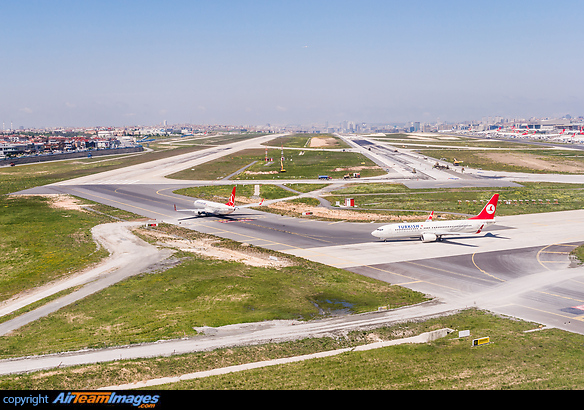 Airborne view on the thresholds of runways 35L and 35R with two TK aircraft about to line up on runway 35L. Runway 35R is under construction at the moment. The terminal building is visible on the right side of the image. Istanbul Ataturk Airport
