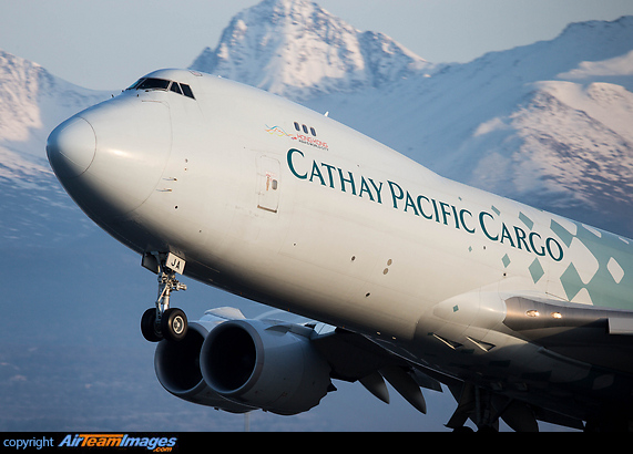 With the amazing Alaskan range as a backdrop Cathay Cargo's World Trader departs for Hong Kong. Boeing 747-867F/SCD
