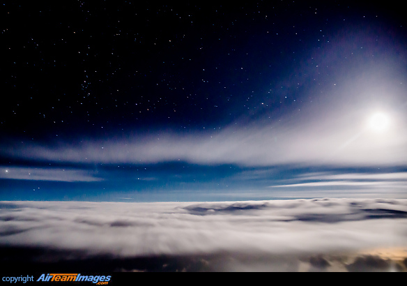 Night sky with the moon shining on clouds over the North Atlantic Skyscape