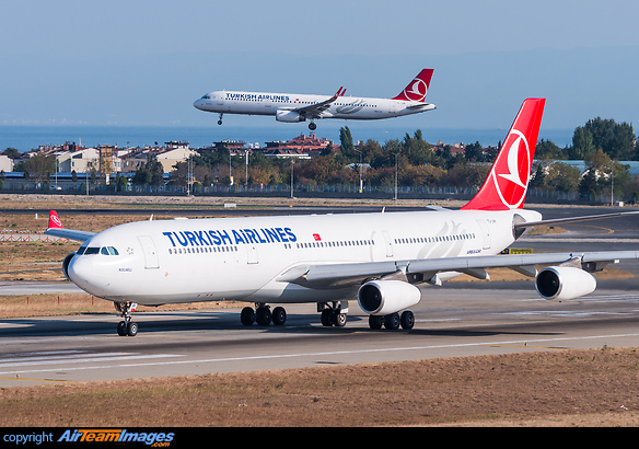 In the background is company ship TC-JSN A321-200 landing on runway 05. Airbus A340-313X