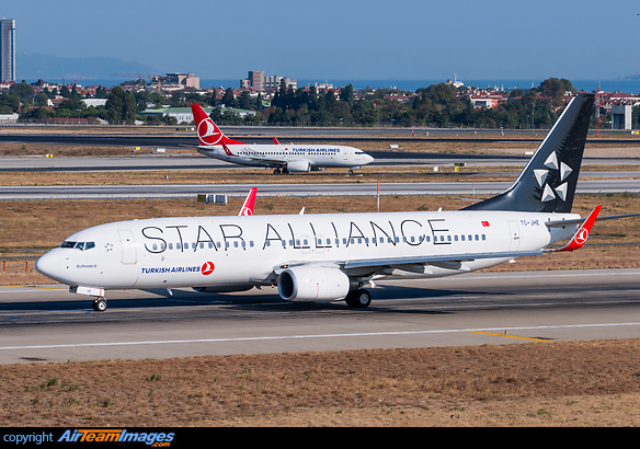 Sistership Boeing 737-700 TC-JKO in the background. Boeing 737-8F2