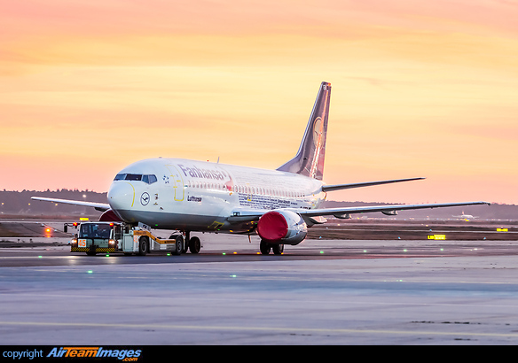 Engines covered and all doors and panels taped after being retired from service the day before. Aircraft is being towed to apron position for storage. Boeing 737-330