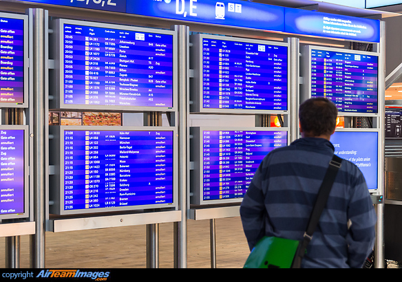 Passenger checks for flights on electronic departure board during the Lufthansa pilot strike. "Annuliert" means cancelled. Frankfurt Main Airport
