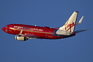 Cranking into the left turn from runway 15 a Virgin 737 departs on a t...