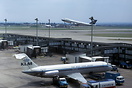 KLM DC-9 PH-DNP is being readied for departure while a BOAC Boeing 747...