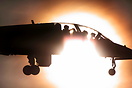 RAF British Aerospace Hawk T1 XX203 passing the bright Sun on finals a...