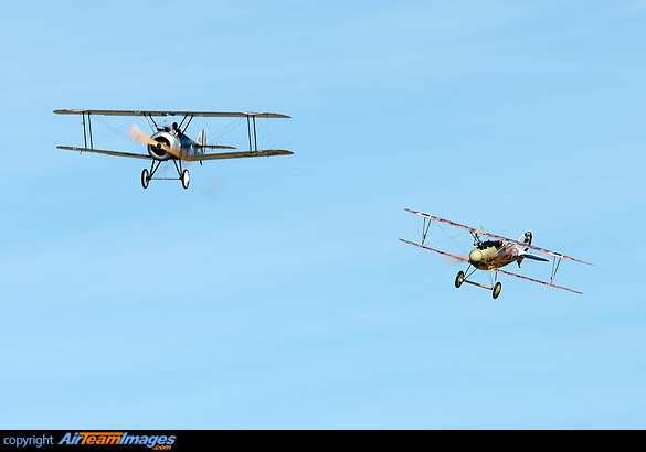 Gene de Marco in the smoke belching Camel, part of its signature hotly pursued by Kermit Weeks in the Albatros DVa during the flying display. Sopwith Camel & Albatros D.Va