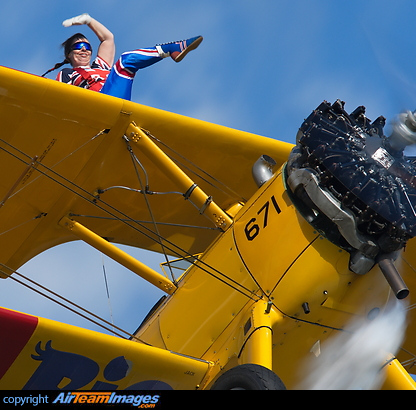 Wingwalker Helen Tempest seen here working hard while displaying at the Baxterley Wings and Wheels 2011 airshow. Boeing E75N1 Stearman