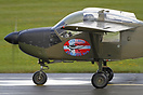 A member of the RDAF T-17 display team "Baby Blue" taxies on the wet t...