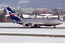 An Aeroflot IL-96 landing in a snow covered Salzburg