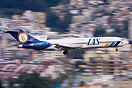 Motion blurred panning shot of a LAS Boeing 727 freighter HK-4636 land...