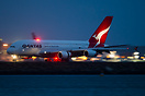 Rolling out well after sunset a Qantas A380.