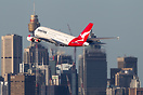Departing off runway 34L a quick fly by of the city for a Qantas A380.