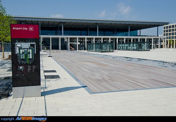 Open plaza in front of the new terminal of the still to open Berlin Brandenburg International Airport named Willy Brandt. In the background is the terminal and in front of it the access to the train station. Berlin Brandenburg Airport