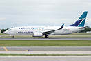 WestJet Boeing 737-800 C-GAWS with "# 100 Boeing 737 NG" sticker.