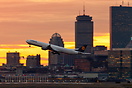 The Lufthansa Airbus A346 powers away from the City of Boston into a n...