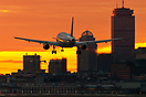 The setting sun to the south in the fall lights up the final approach ...