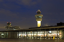 View of the old and the new control Tower in AMS with departing Fokker...