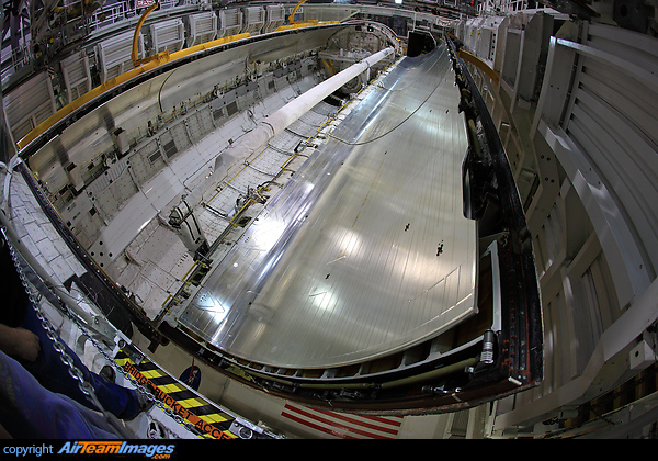 A momentous day as space shuttle orbiter "Discovery' has her payload bay sealed for history. The port door is closed and the starboard door swings by on its way to close the coffin-like payload bay. The doors are powered for the low gravity environment of low Earth orbit hence they need special rig/procedures to be opened and closed on Earth thus these were sealed shut for posterity to prevent damage. Rockwell Space Shuttle