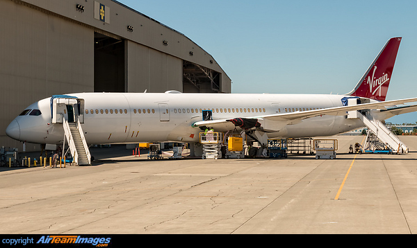 A look at Virgin Atlantic's first Dreamliner after factory rollout. This Boeing 787-9 Dreamliner will fly with the registration G-VNEW when entering service and carries the numeric production numbers C/N 40956 and L/N 218. The 2 RR Trent 1000 engines have yet to be installed, hence the weight blocks in their place. The configuration is set to carry 264 passengers with the breakdown of C31W35Y198. Boeing 787-9 Dreamliner