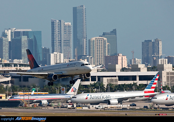 On short final to 28L at KMIA with the City of Miami in the background. Airbus A320-211