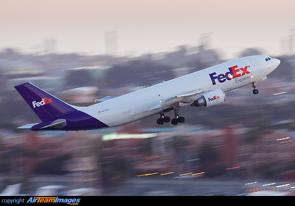 Motion-blurred panning photo of a FedEx Airbus A300 N672FE departing from LAX airport after sunset Airbus A300F4-605R