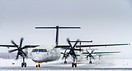 Exiting the de-icing bay, followed by Air Inuit C-FYAI Dash 8-300 and ...