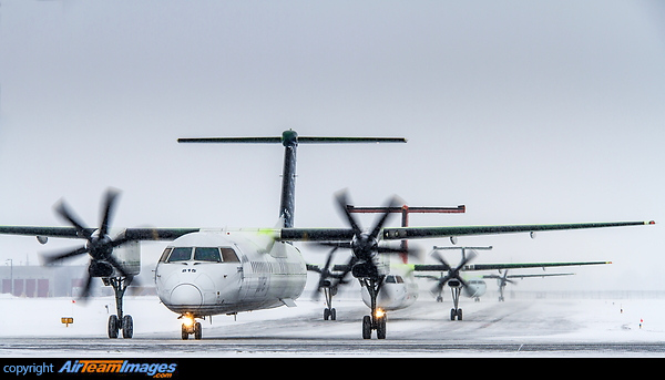 Exiting the de-icing bay, followed by Air Inuit C-FYAI Dash 8-300 and Air Canada Express (Jazz Air) C-GMON Dash 8-300. Bombardier Dash 8-402Q