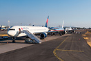 All American operators are being parked on the ramp, with a Delta Boei...