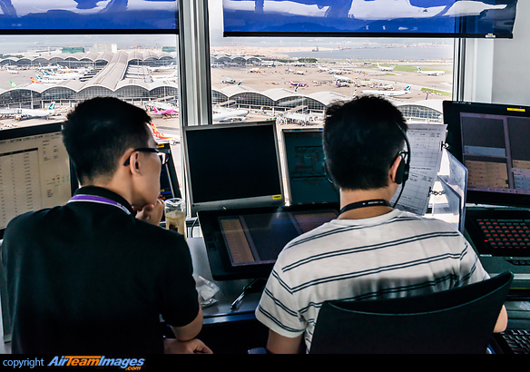 Air traffic controllers inside the ATC tower. Hong Kong Chek Lap Kok ATC