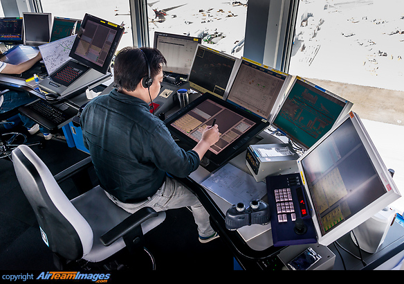 Air traffic controllers inside the ATC tower. Hong Kong Chek Lap Kok ATC