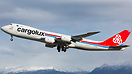 A heavy Cargolux B-748 departs Anchorage for New York.