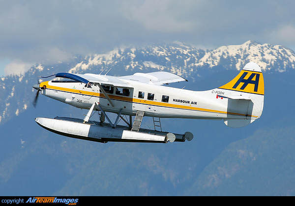 The oldest surviving Otter in service (serial number 3, built in 1952), seen departing Vancouver Harbour with Grouse Mountain behind. DHC-3T Vazar Turbine Otter