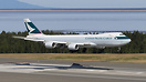 A Cathay Cargo Boeing 747-8F floats over the threshold of runway 07R a...
