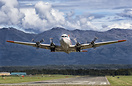 Heavy with fuel a DC-4 gets airborne from Palmer Alaska with the amazi...