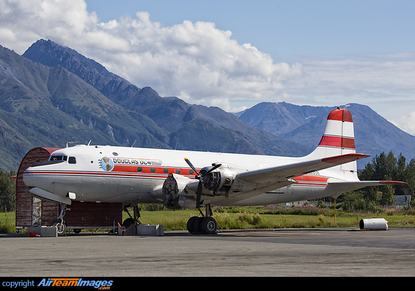 An Alaska Air Fuel DC-4 undergoing heavy maintenance outdoors at Palmer Airport Alaska. Douglas C-54E (DC-4)